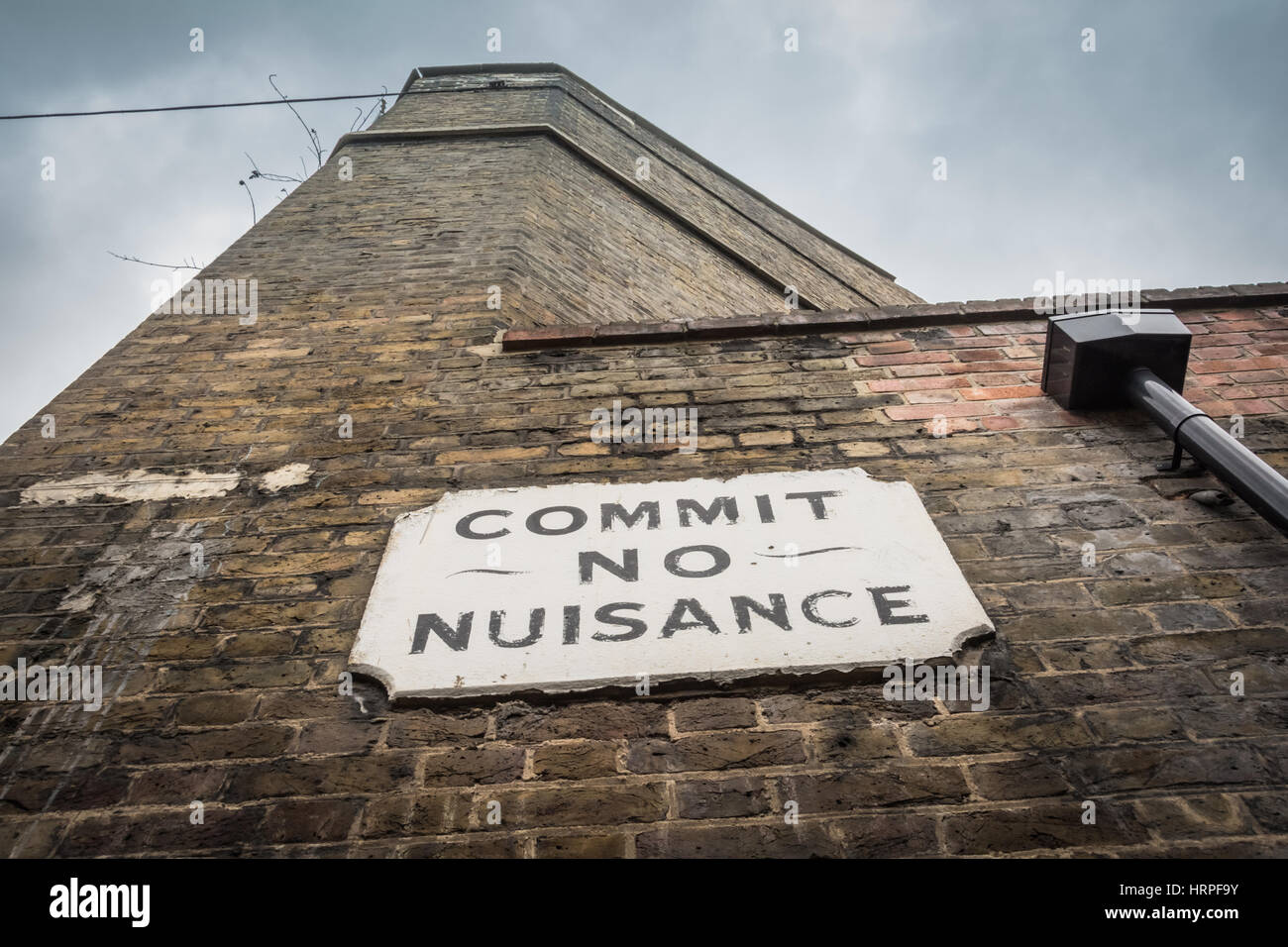A Victorian 'Commit No Nuisance' bylaw street sign in Doyce Street, Southwark, London, SE1, UK Stock Photo