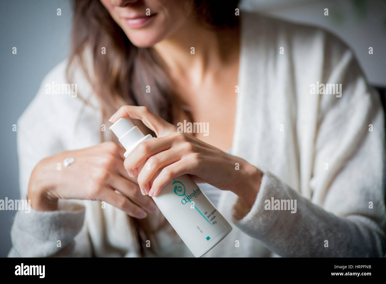 Woman applying estrogen gel on hires stock photography and images Alamy