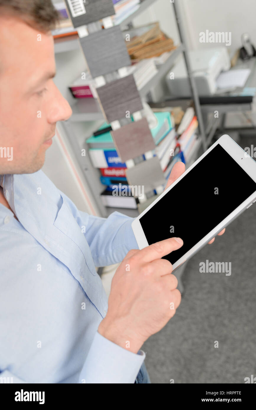 Worker using a tablet computer Stock Photo - Alamy