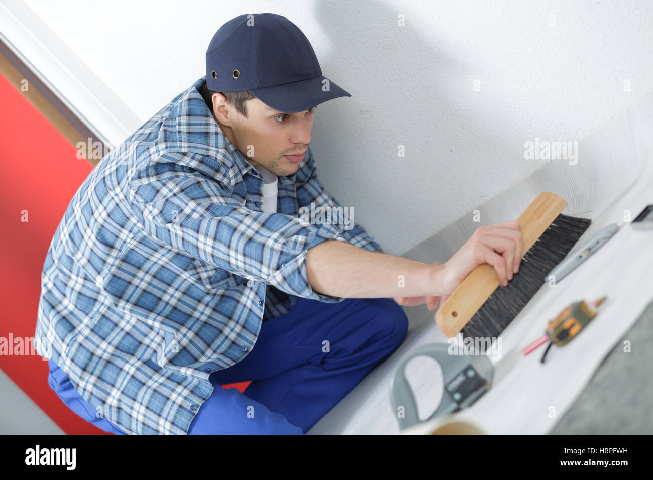 worker fitting tiling at construction site Stock Photo Alamy