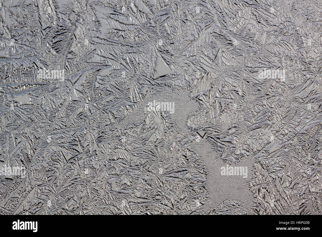 This is frosty pattern on glass winter window Stock Photo - Alamy
