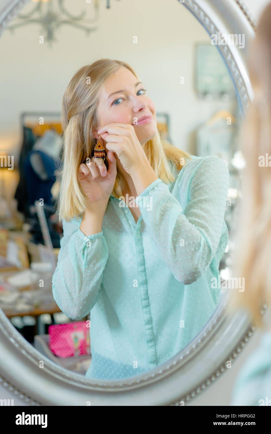 Girl wearing earrings hi-res stock photography and images - Alamy