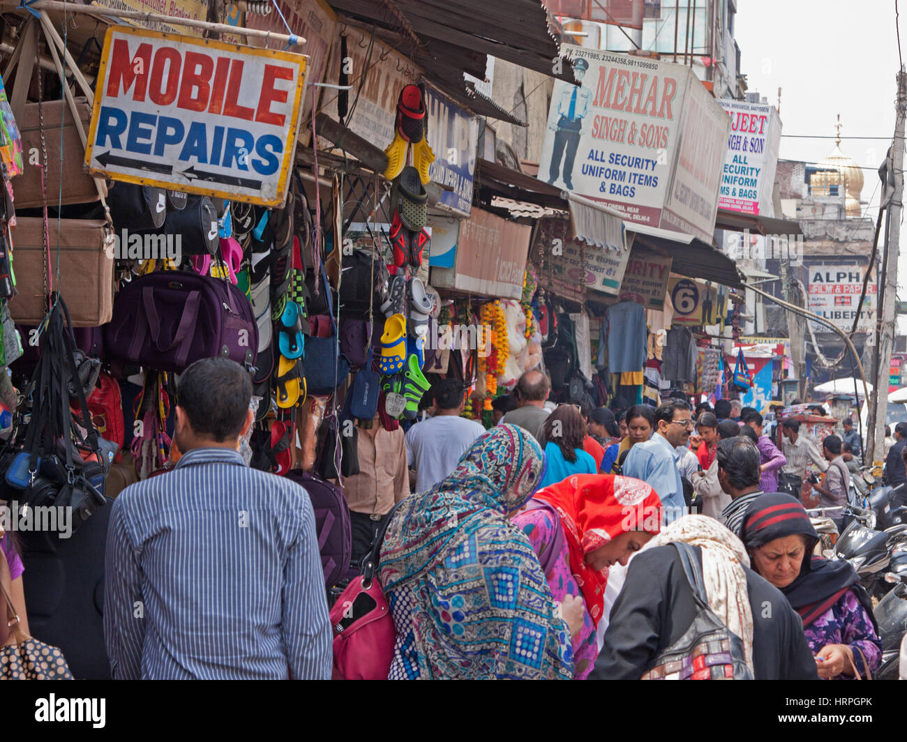 Bustling street scene in the heart of the Chandni Chowk bazaar area in the centre of old Delhi, India Stock Photo