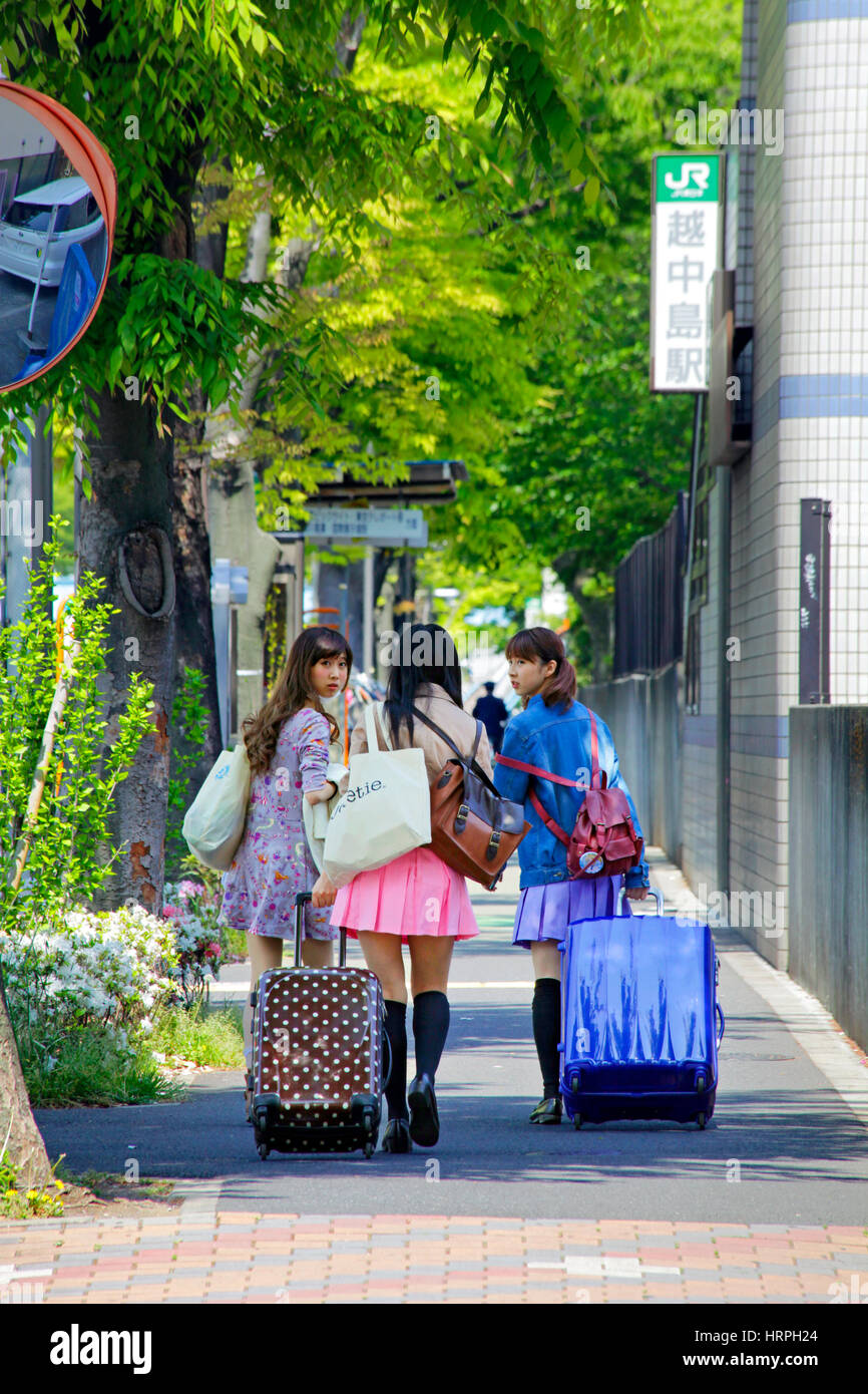 Walking with Suitcases in Tokyo Japan Stock Photo Alamy
