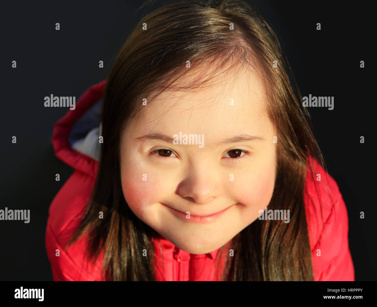 Portrait of little girl smiling outside Stock Photo - Alamy