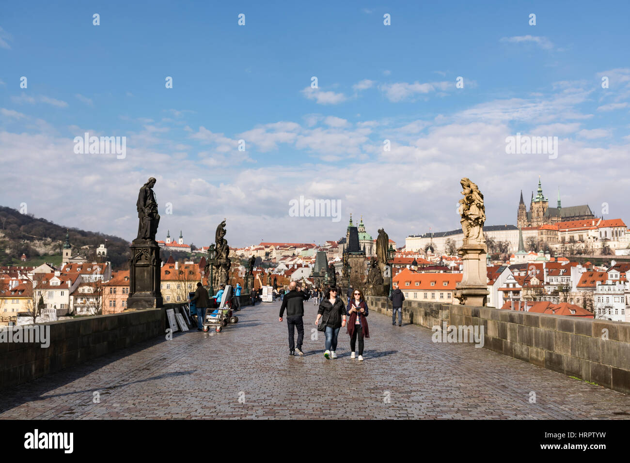 Tourists walking in Charles Bridge, UNESCO World Heritage Site, Prague, Czech Republic, Europe Stock Photo