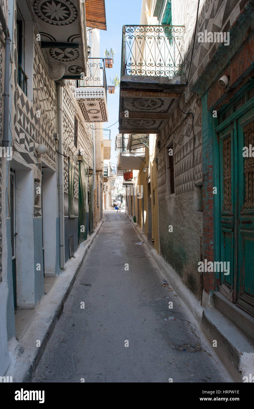 The streets of the medieval village of Pyrgi in Chios with houses covered with xysta (sgraffito) decorative motives.  Pyrgi in Chios is known as the ' Stock Photo