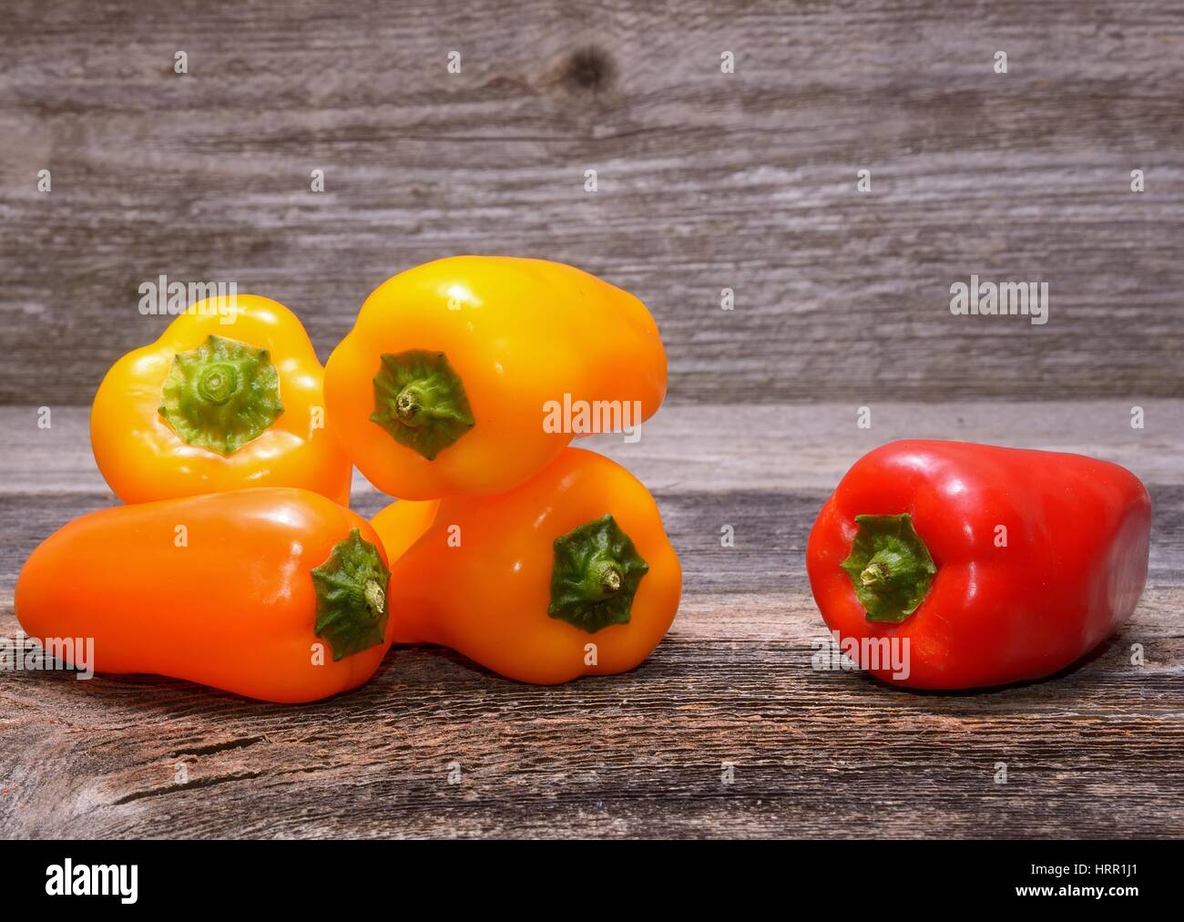 sweet peppers on wooden table background Stock Photo - Alamy
