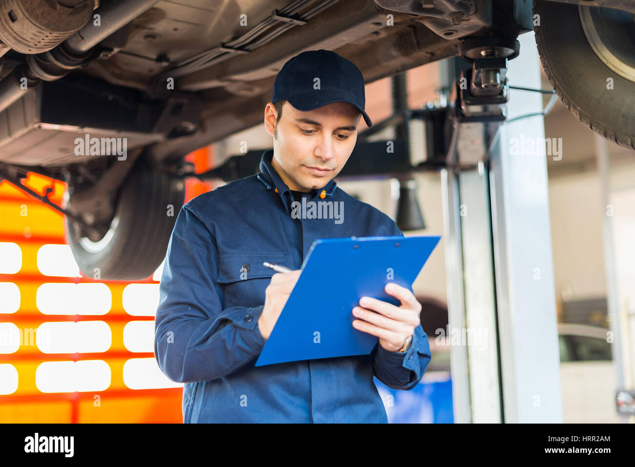 Workcomp Mechanic Portrait of a mechanic at work in his garage Stock Photo - Alamy