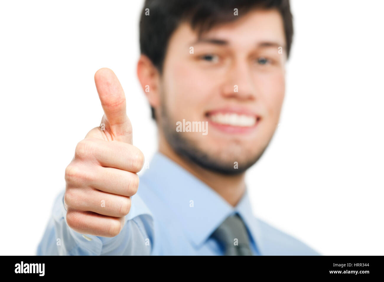 Smiling business man thumbs up isolated on white Stock Photo