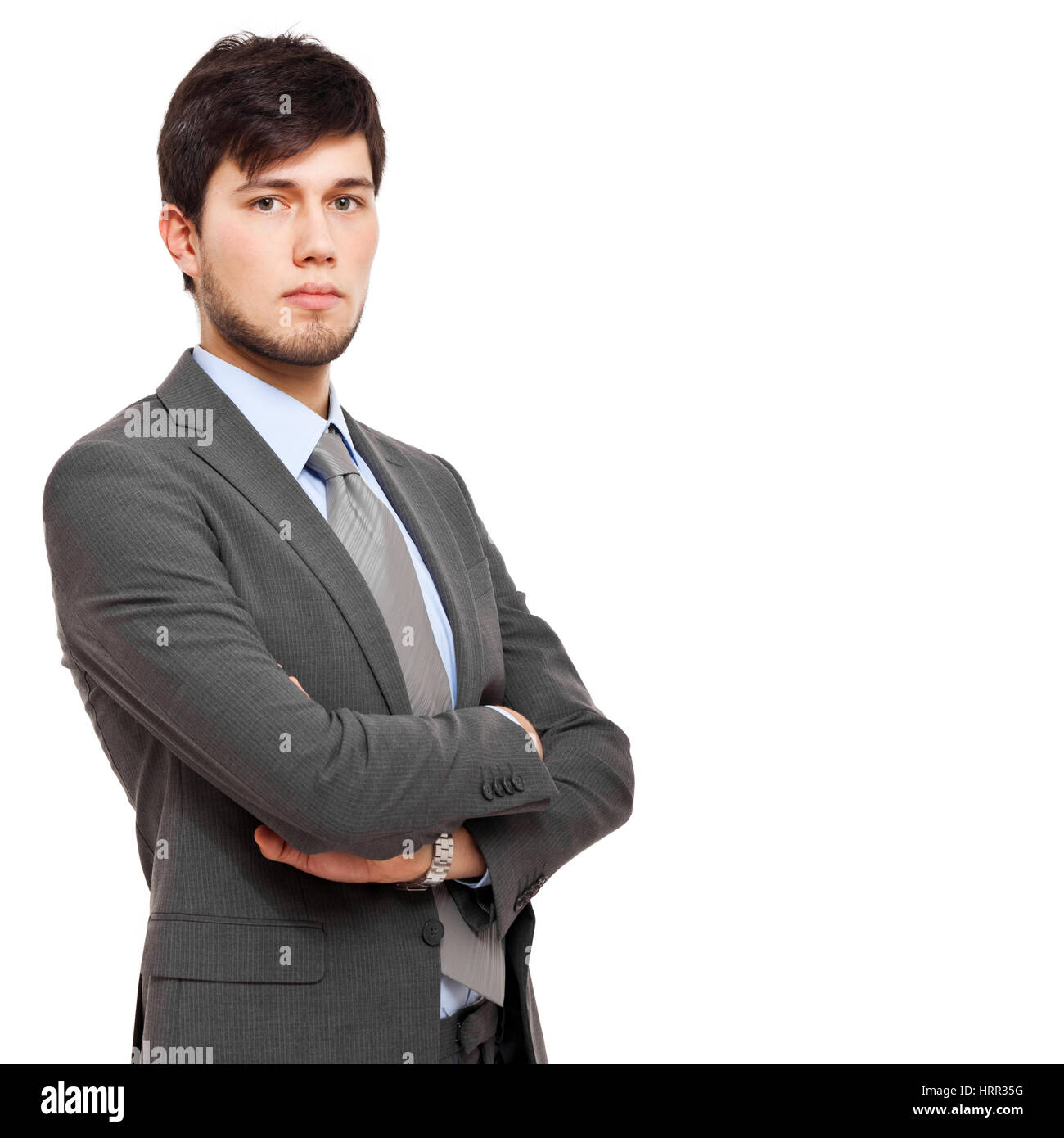 Confident young businessman isolated on white Stock Photo - Alamy