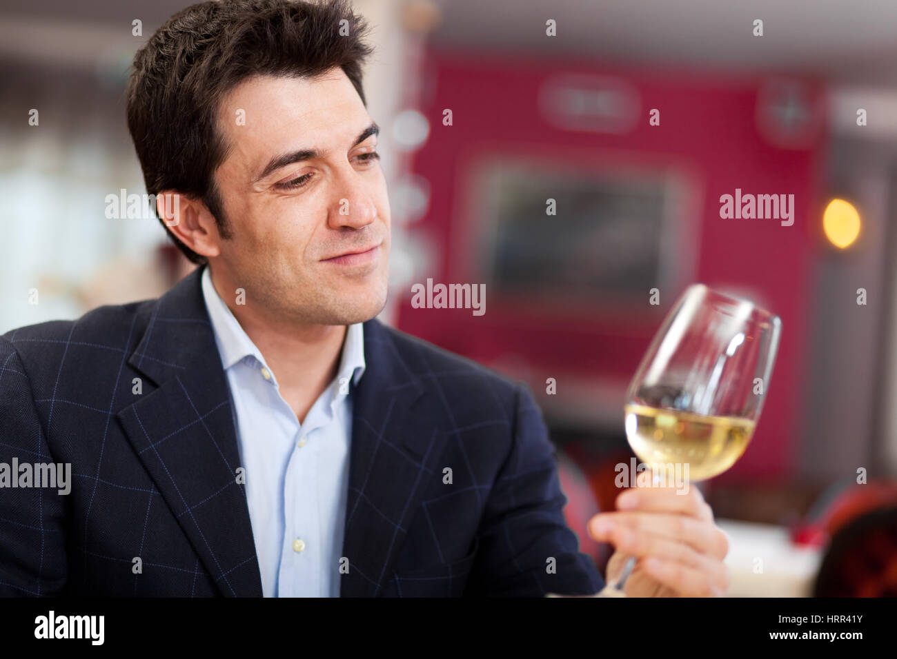 Man tasting white wine Stock Photo - Alamy