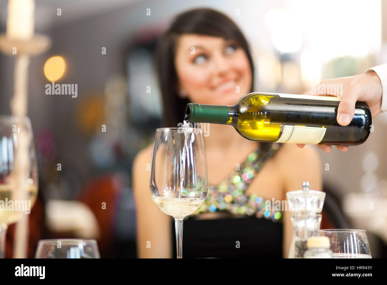 Waiter serving woman at the restaurant Stock Photo Alamy