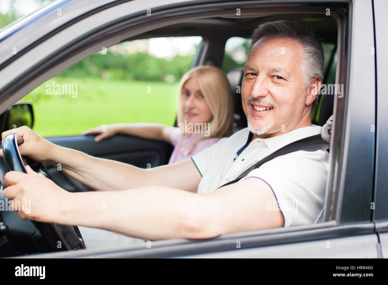 Mature couple traveling in their car Stock Photo