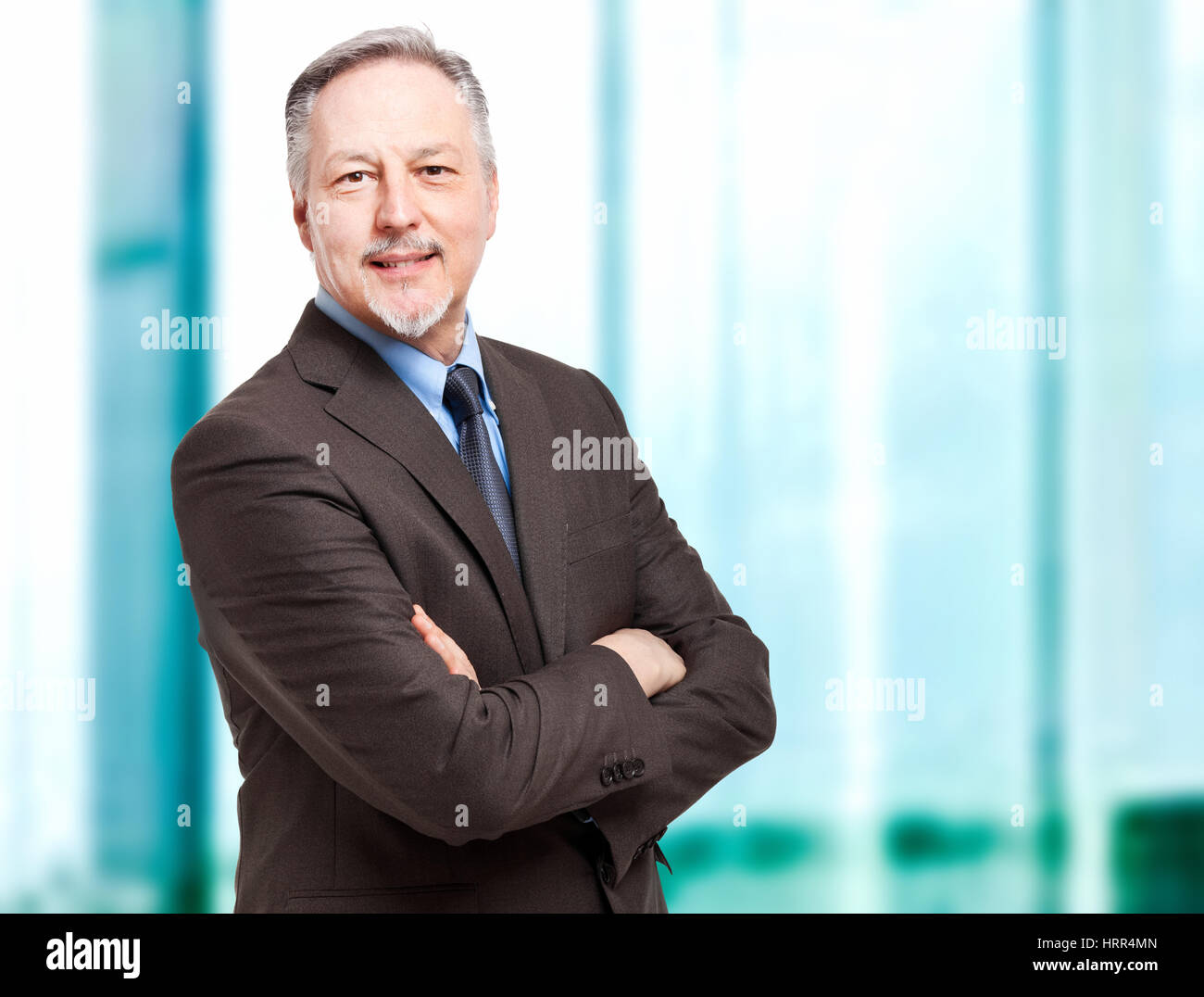 Mature businessman portrait in the office Stock Photo - Alamy