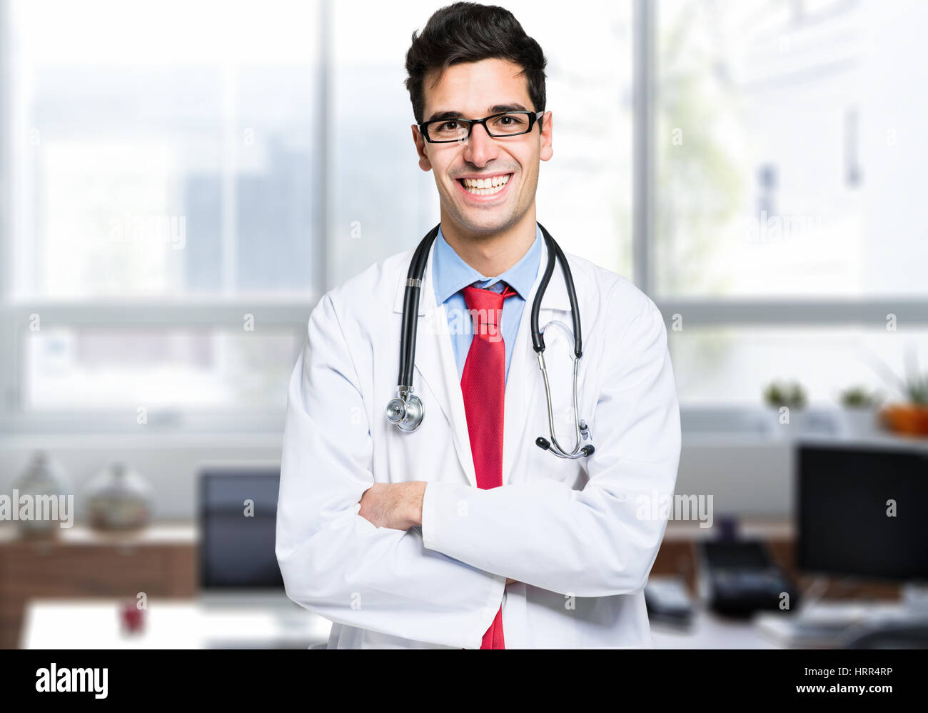 Handsome young doctor hi-res stock photography and images - Alamy