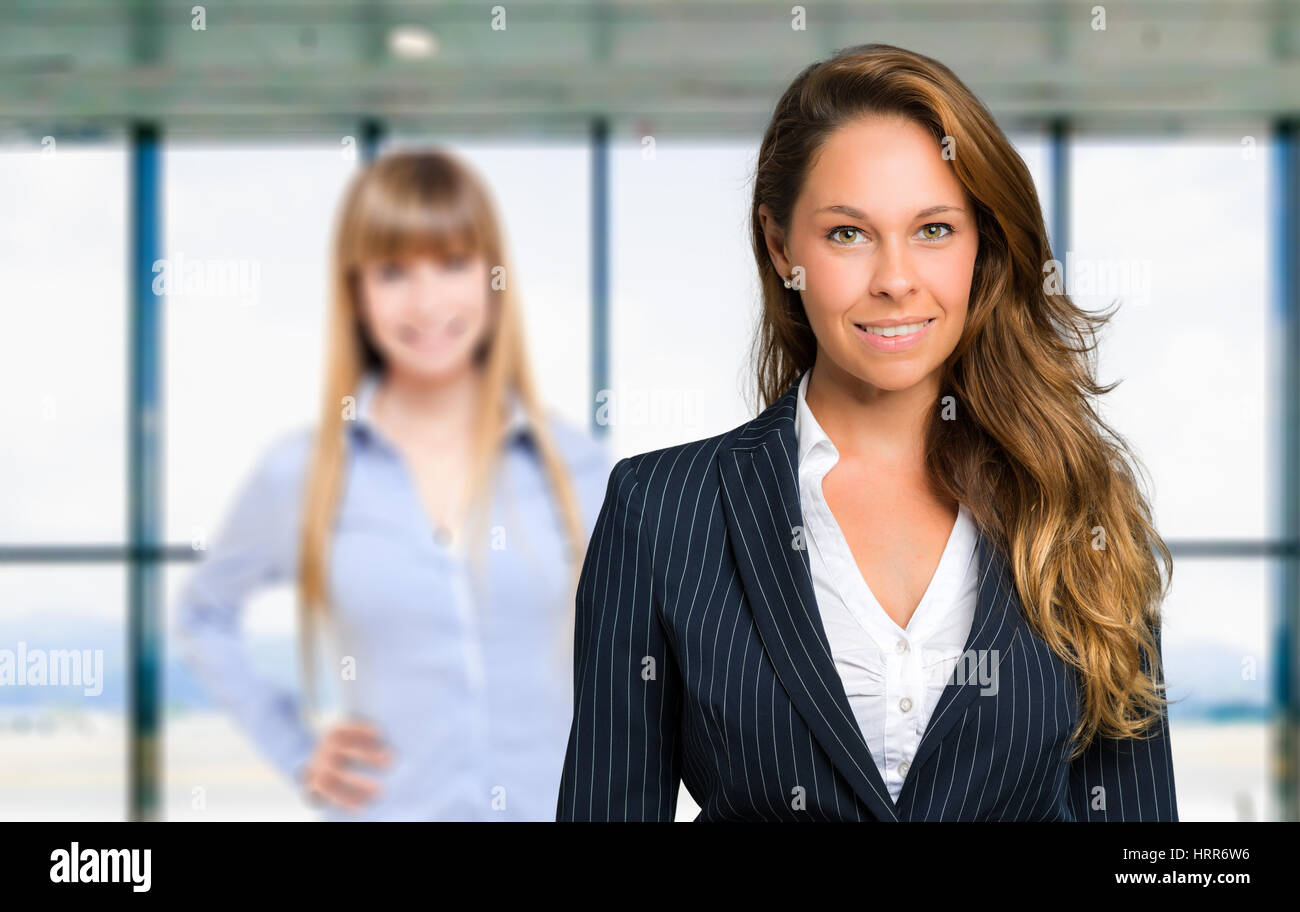 Two happy confident businesswomen hi-res stock photography and images ...
