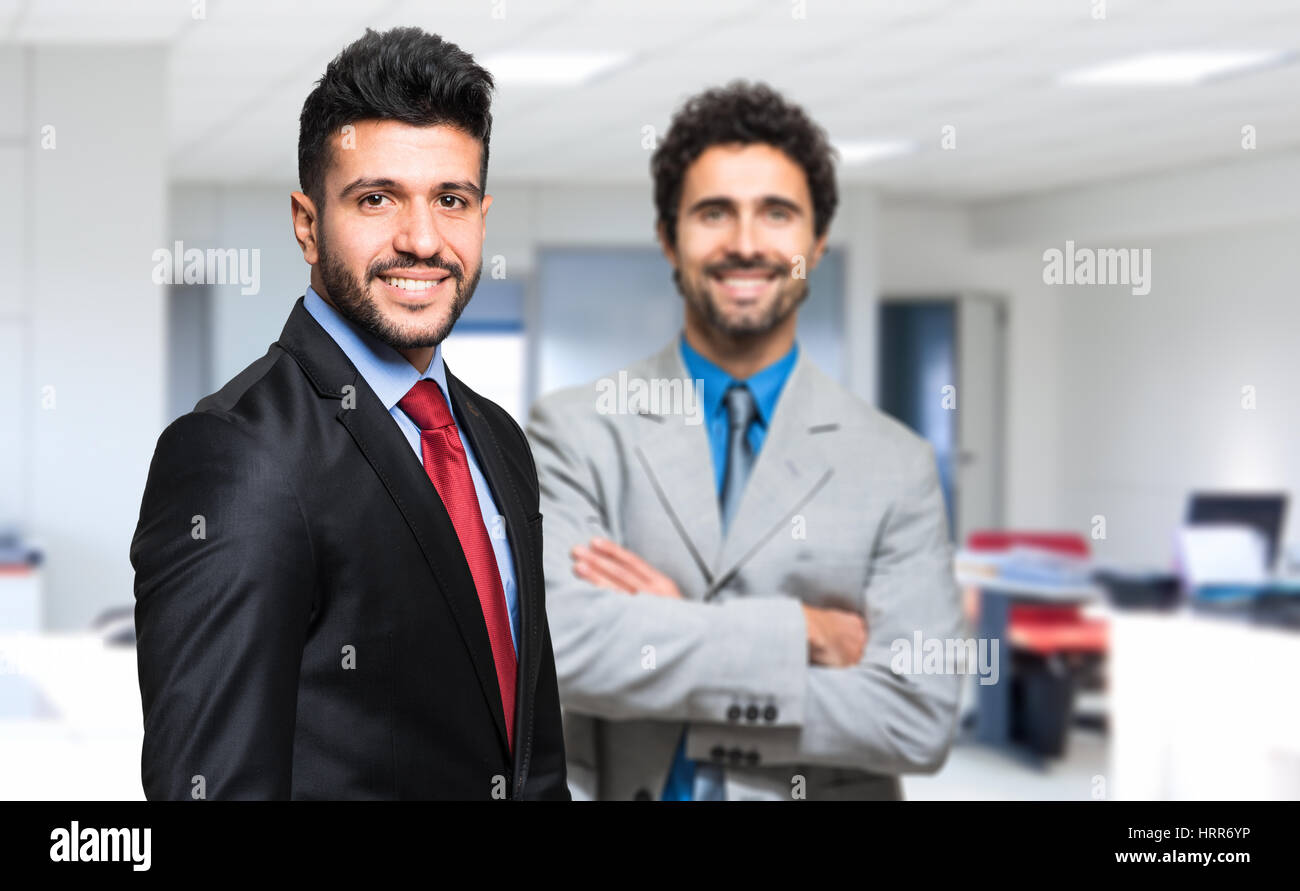 Two businessman sharing an office Stock Photo Alamy