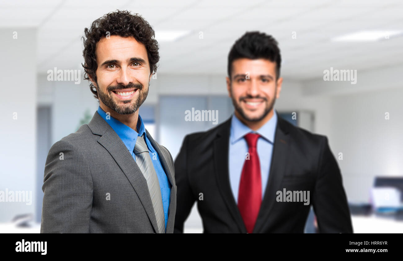 Two businessman sharing an office Stock Photo Alamy