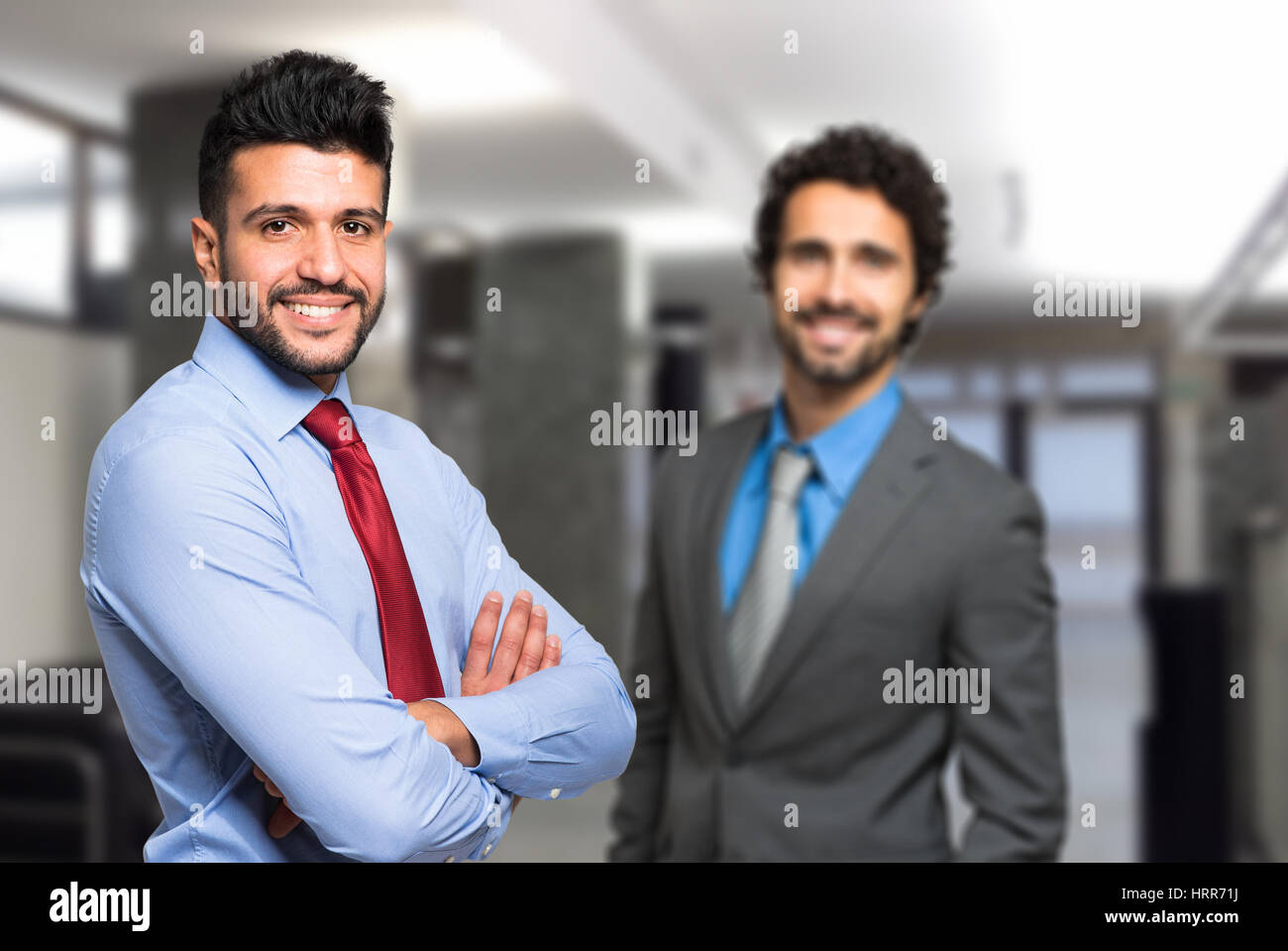 Two businessman sharing an office Stock Photo Alamy