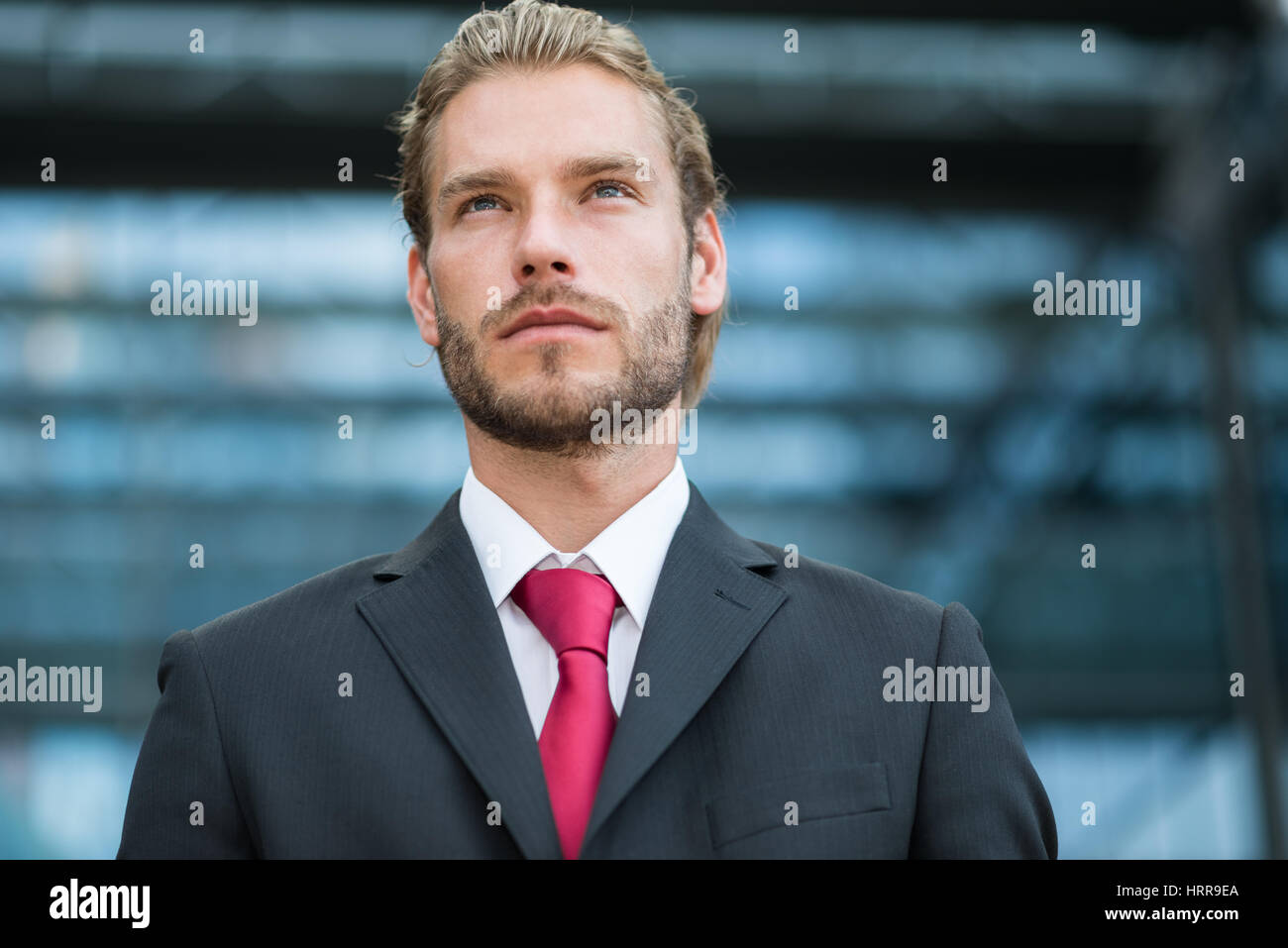 Portrait of a young handsome businessman Stock Photo - Alamy