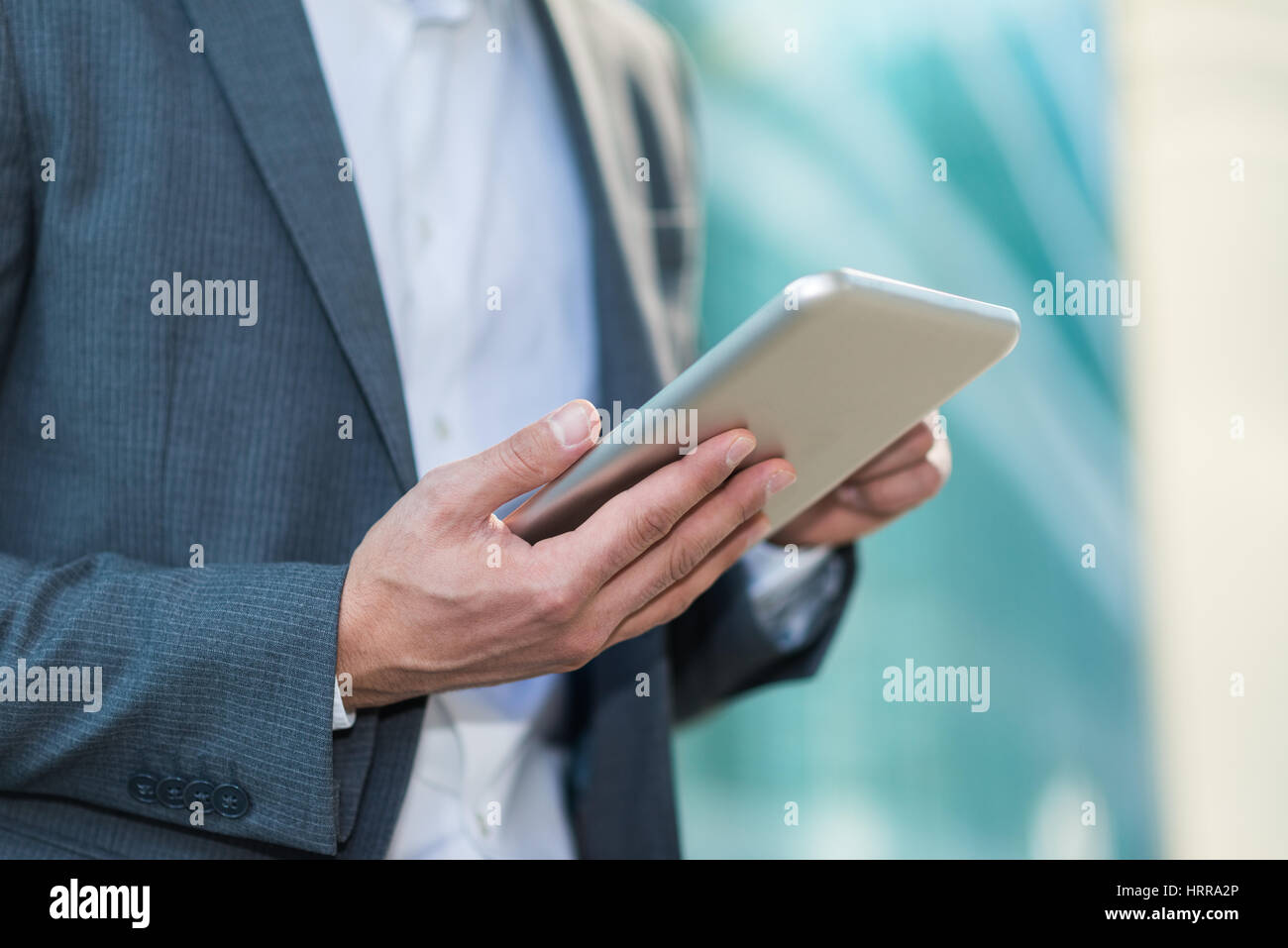 Businessman using his digital tablet Stock Photo - Alamy