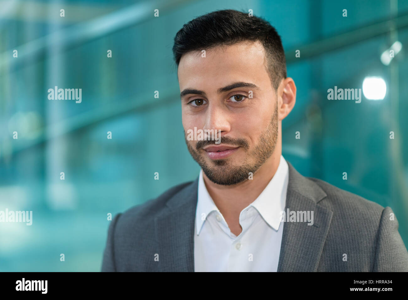 Portrait of a smiling young businessman Stock Photo - Alamy