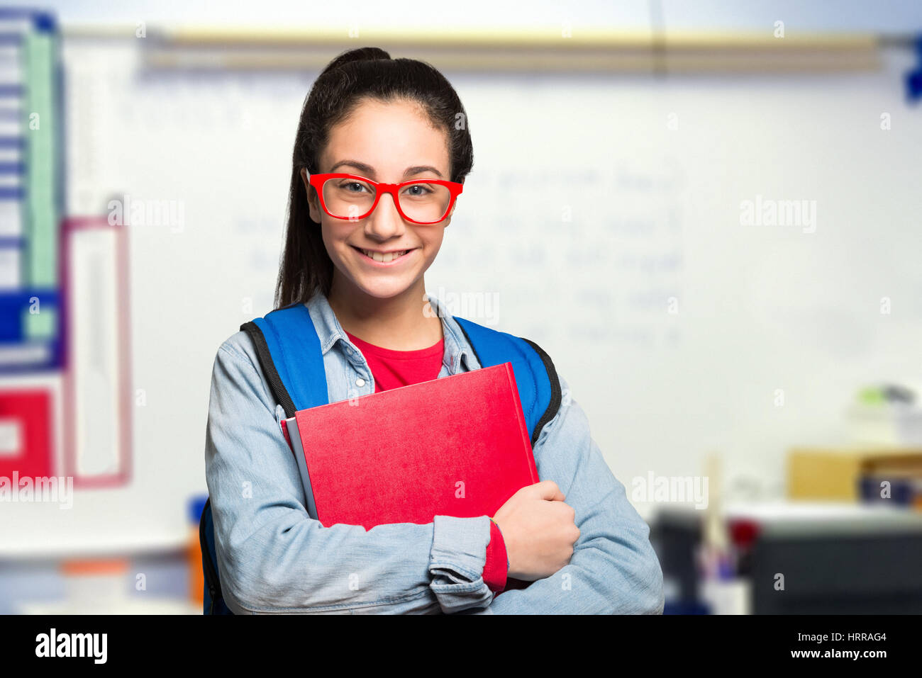 Smiling student girl in her classroom Stock Photo - Alamy