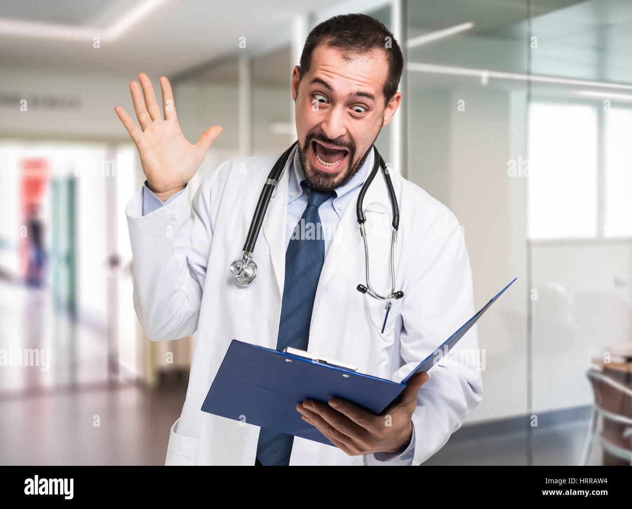 Shocked Doctor Reading A Document Stock Photo Alamy