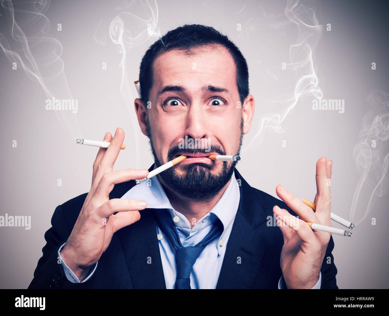 smoked too many cigarettes Nervous businessman smoking many cigarettes hi-res stock photography and  images