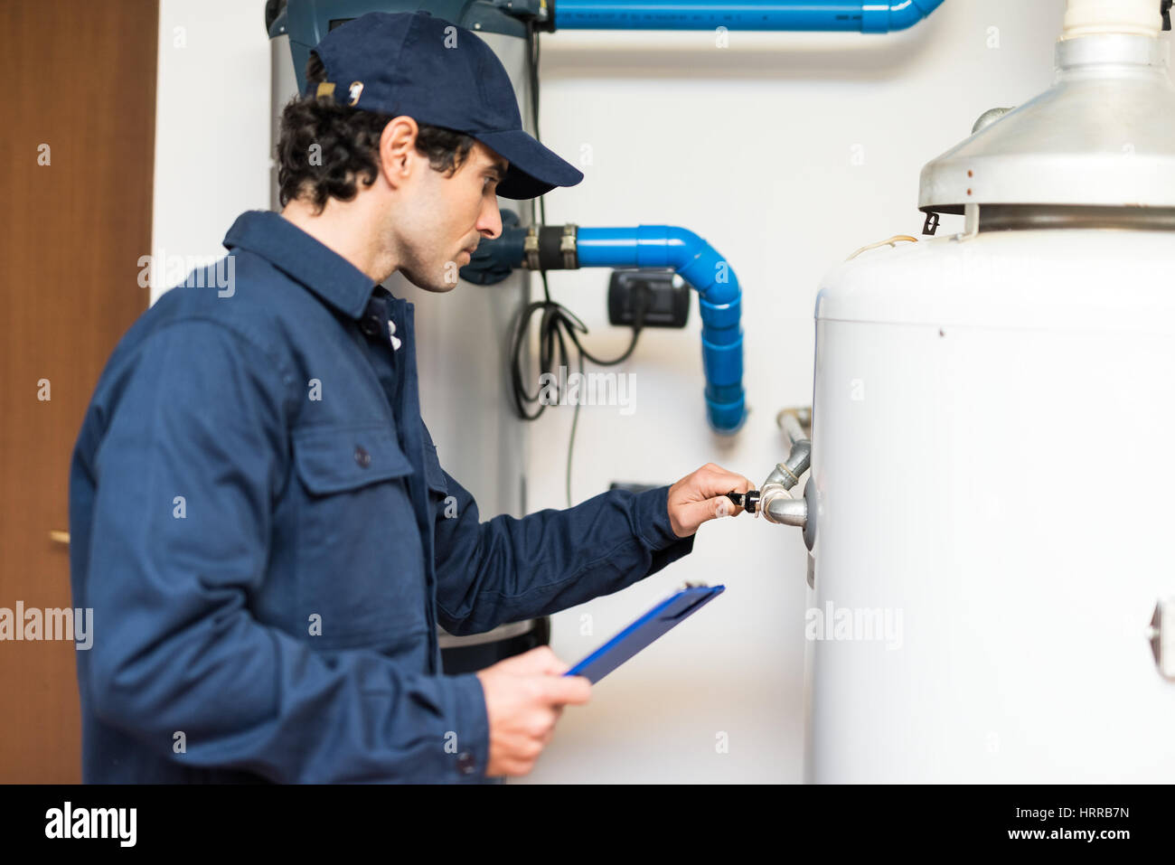 Technician opening a valve Stock Photo Alamy