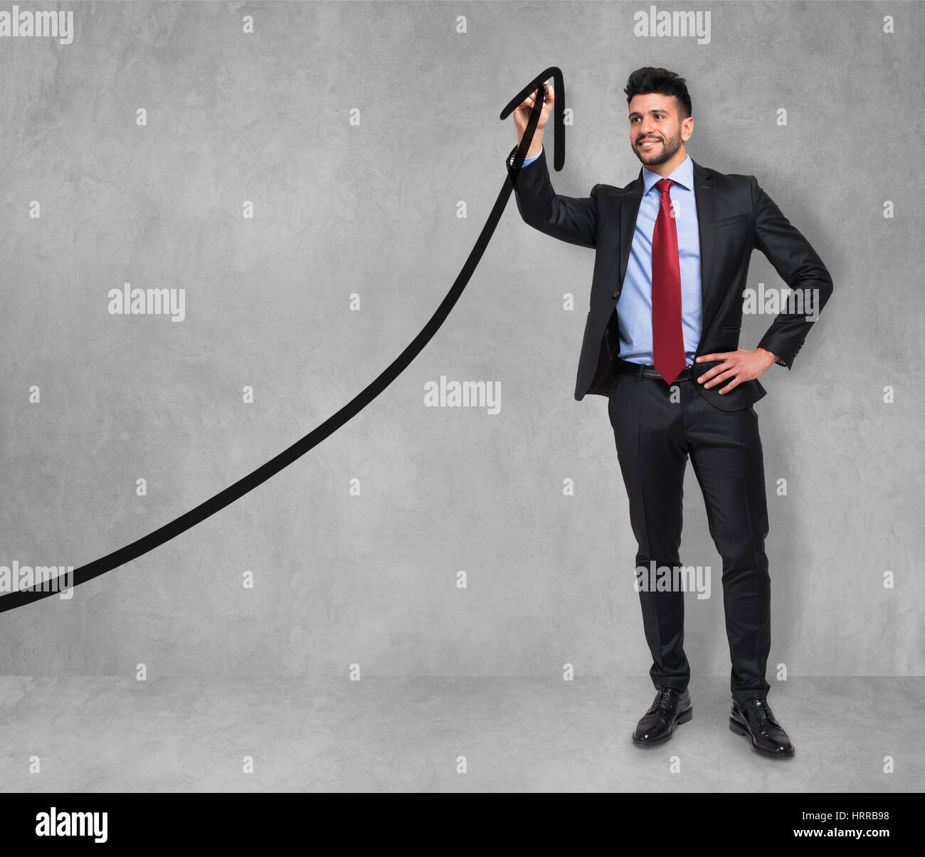Businessman drawing a rising arrow, business growth concept Stock Photo ...