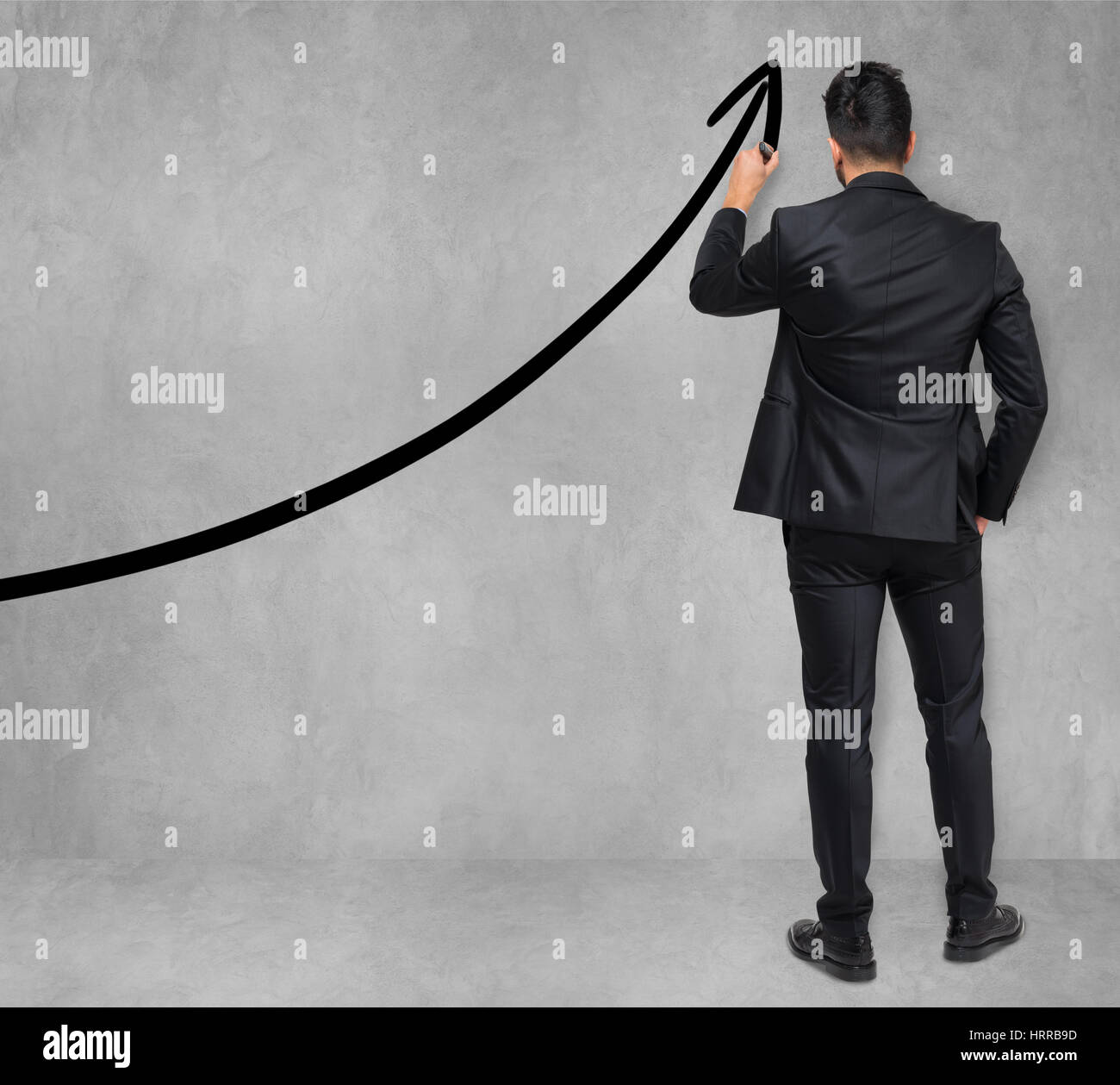 Businessman drawing a rising arrow, business growth concept Stock Photo ...