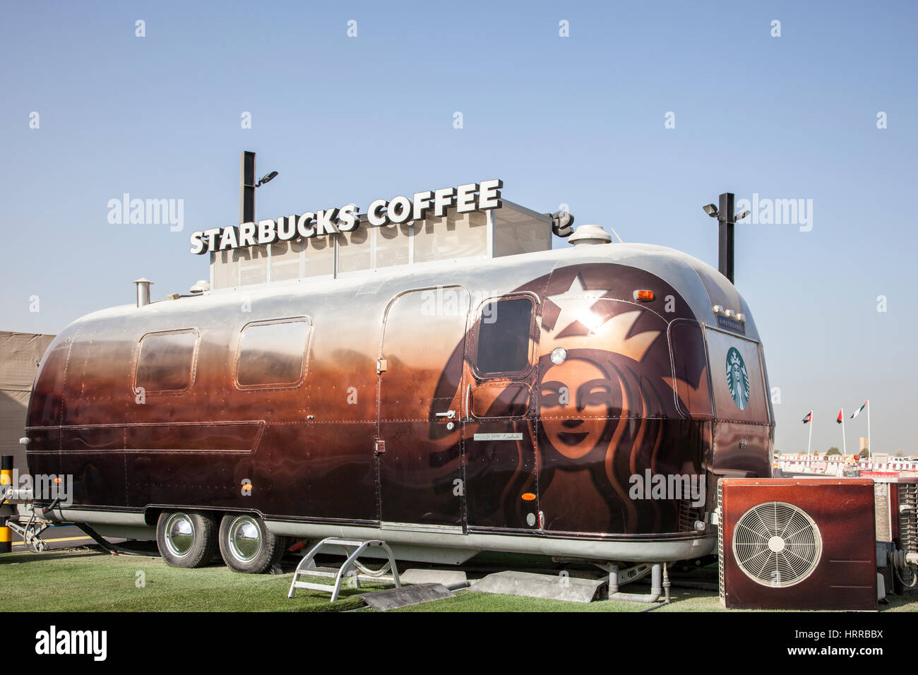 DUBAI, UAE - NOV 27, 2016: Airstream caravan converted to the Starbucks Coffee shop at the Last Exit food trucks park on the E11 highway in United Ara Stock Photo