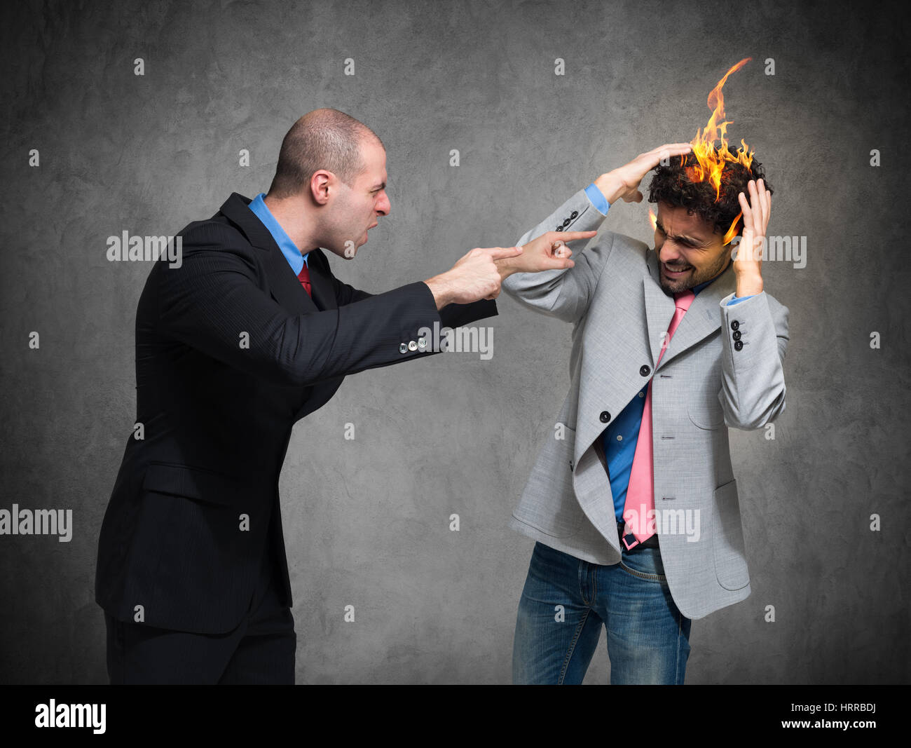 You're fired! Conceptual image of a businessman 'firing' another one Stock Photo