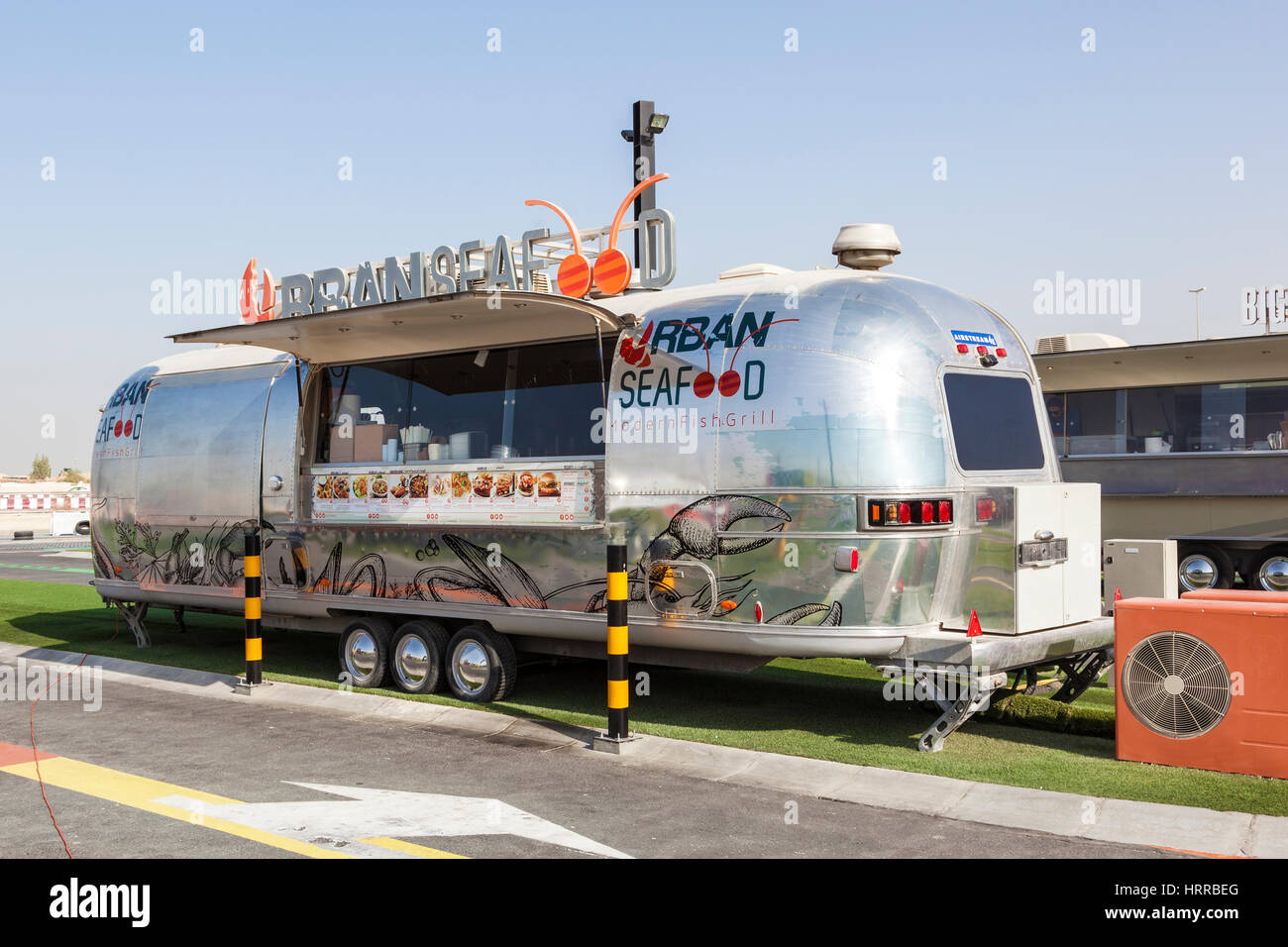 DUBAI, UAE - NOV 27, 2016: Airstream caravan converted to the Urgan Seafood truck at the Last Exit food trucks park on the E11 highway between Abu Dha Stock Photo