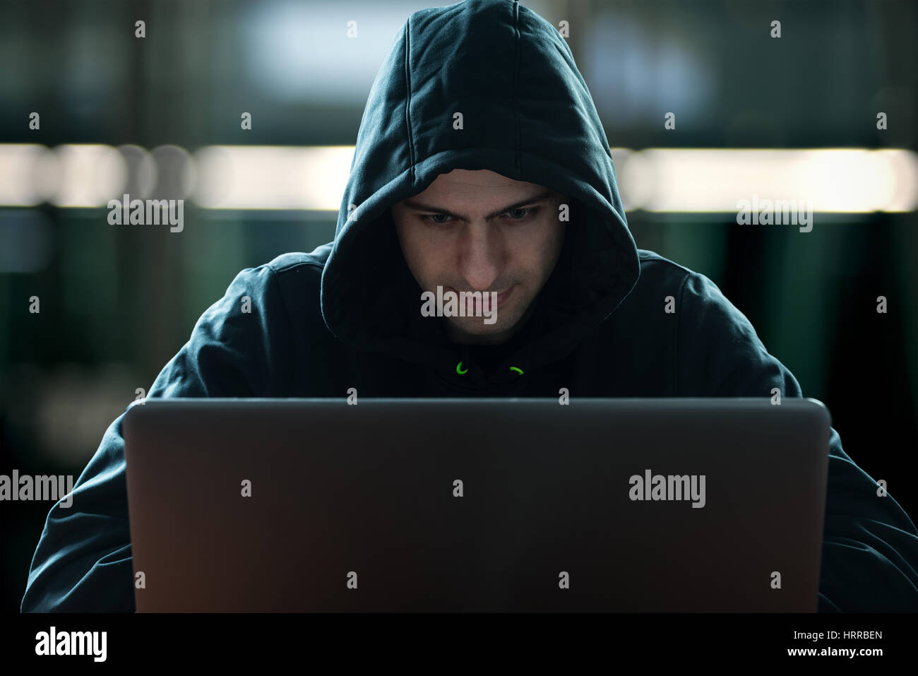 Hacker in front of his computer Stock Photo