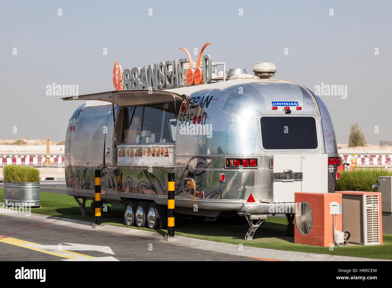 DUBAI, UAE - NOV 27, 2016: Airstream caravan converted to the Urgan Seafood truck at the Last Exit food trucks park on the E11 highway between Abu Dha Stock Photo