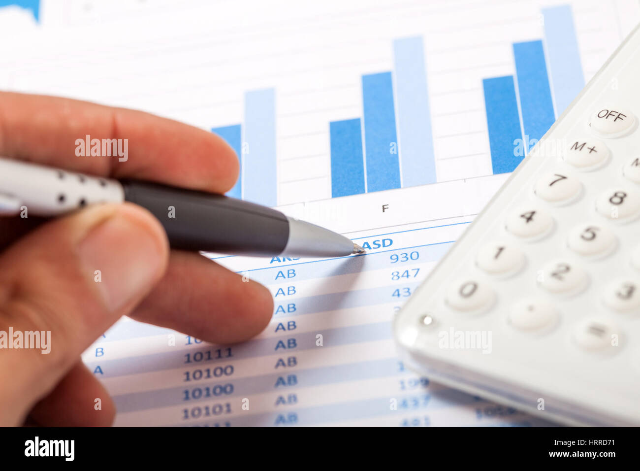 Accountant checking numbers on a document stock photo alamy