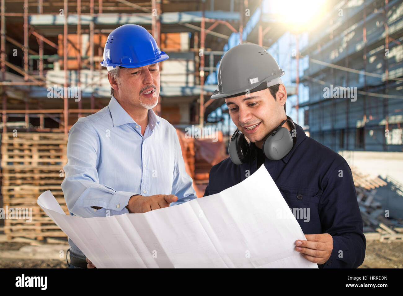 Portrait of workers in a construction site Stock Photo - Alamy