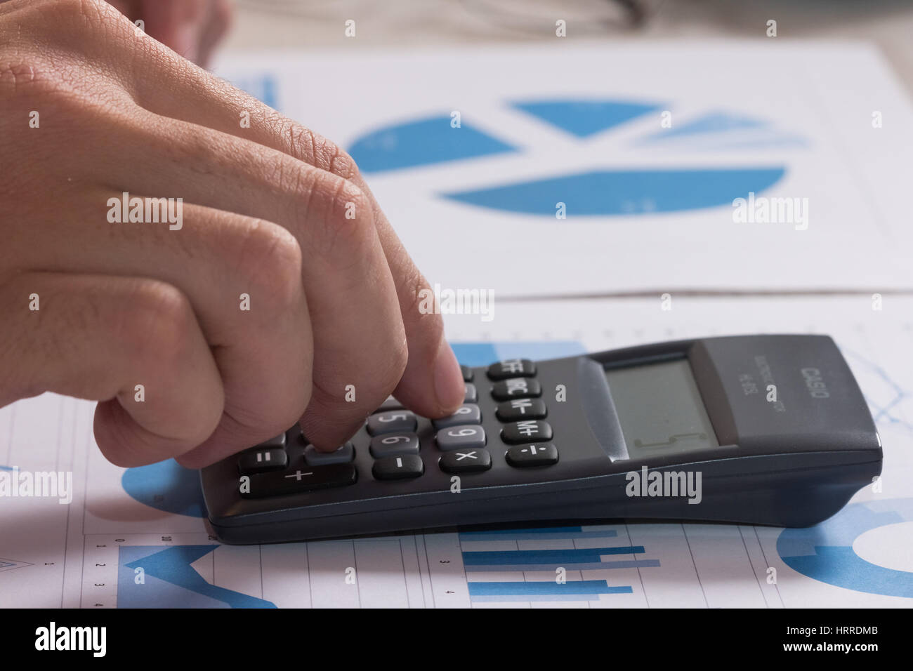 Accountant checking numbers on a document stock photo alamy