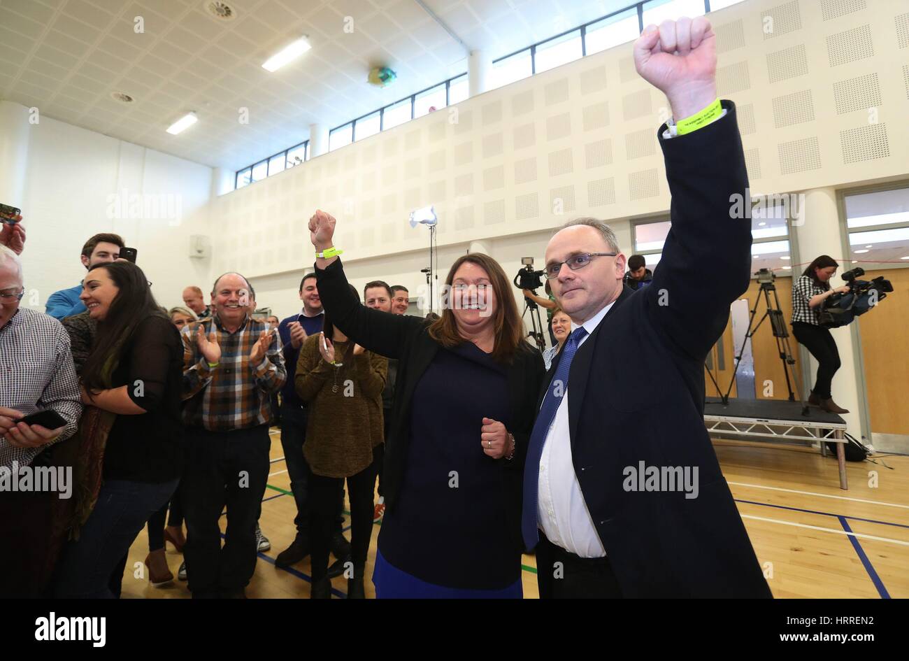 Sinn Fein candidates for West Tyrone Barry McElduff (right) and Michaela Boyle celebrate having been deemed elected at the Omagh count centre as counting in Northern Ireland's Assembly election is underway. Stock Photo