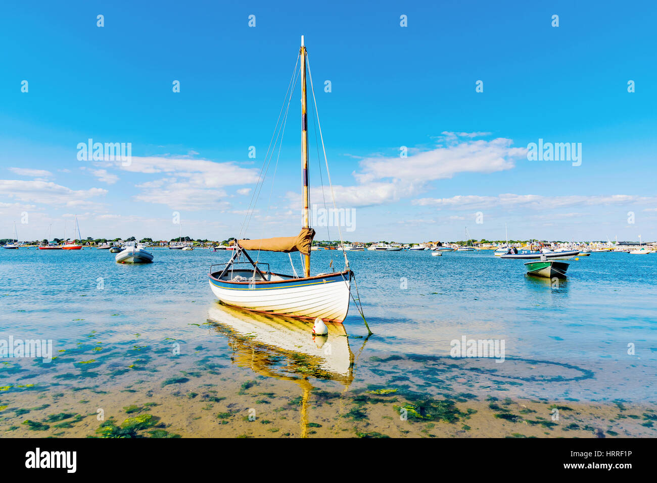 Boats with blue sky and clear sea in England Stock Photo - Alamy