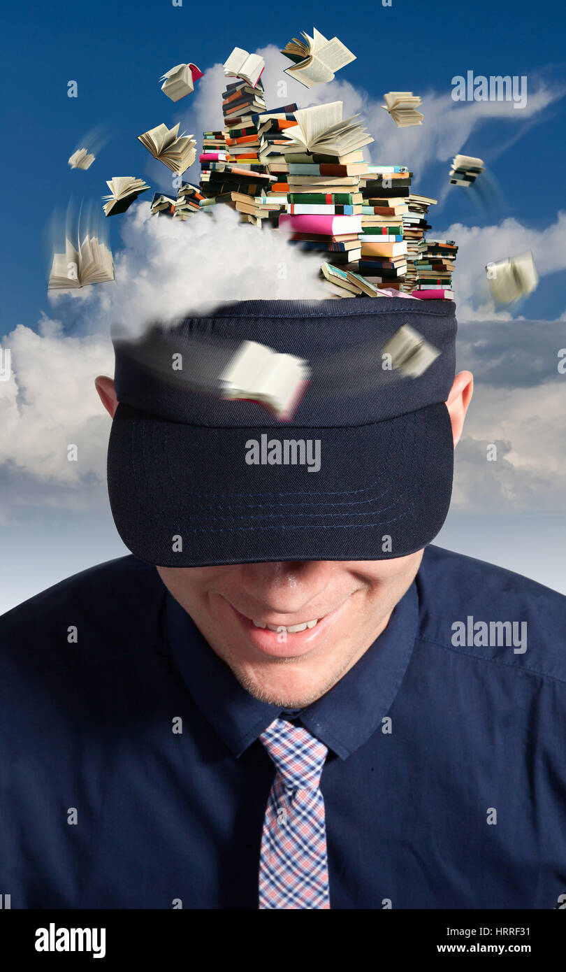 The Big reader with a hat, which looking like a mountain of books on a background of clouds. Stock Photo