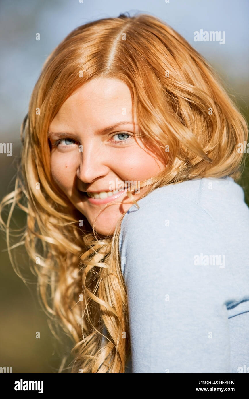 happy woman portrait smiling outdoors in a park Stock Photo - Alamy
