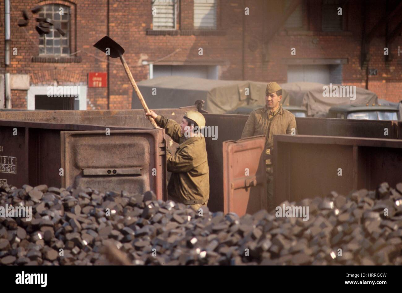 Soviet army soldiers unload a coal train in Riesa town (German Democratic Republic) in 1991 Stock Photo