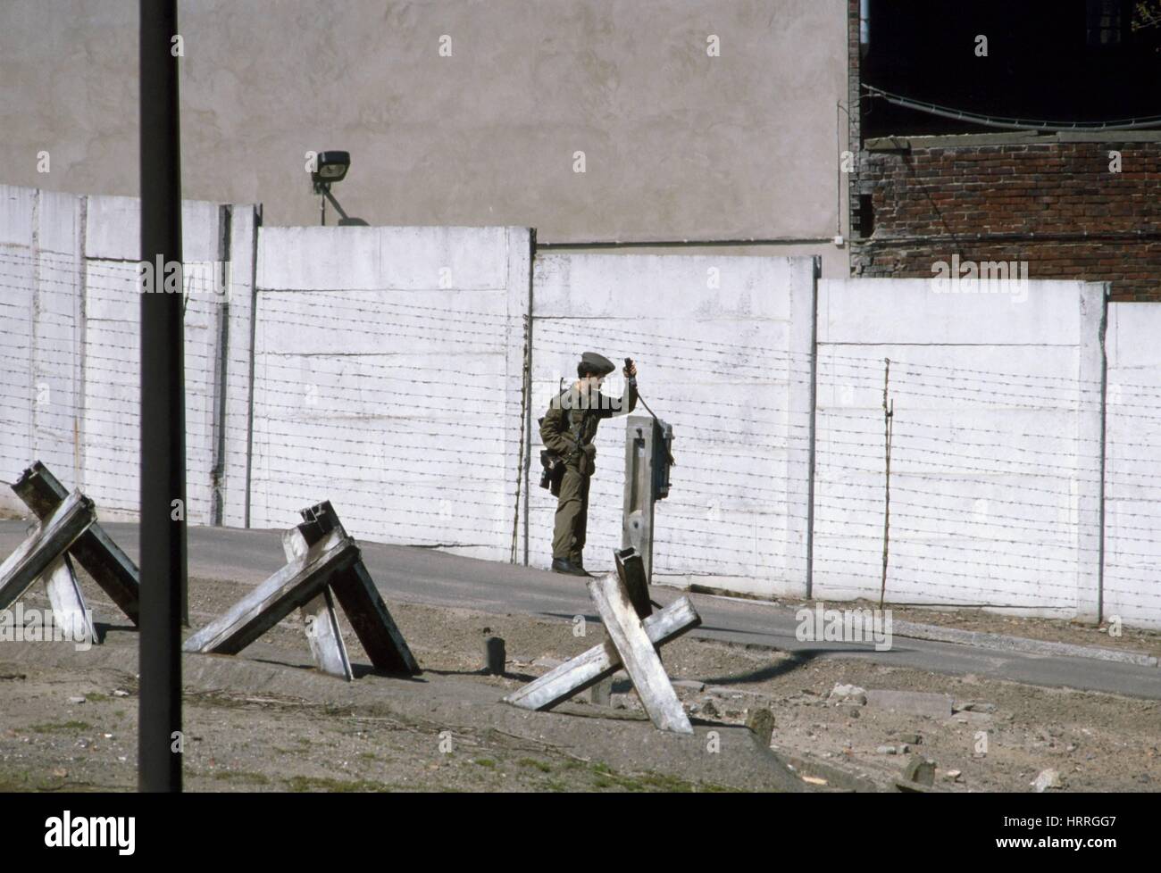 The Berlin Wall in 1986, DDR border police ( Volkspolizei ) Stock Photo