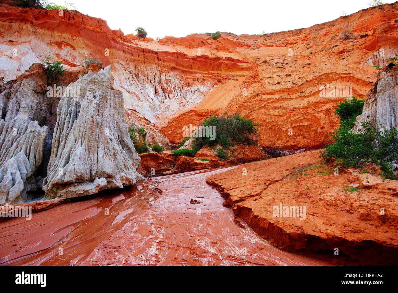 Red river running through the Ham Tien canyon, Mui Ne, Vietnam. Stock Photo