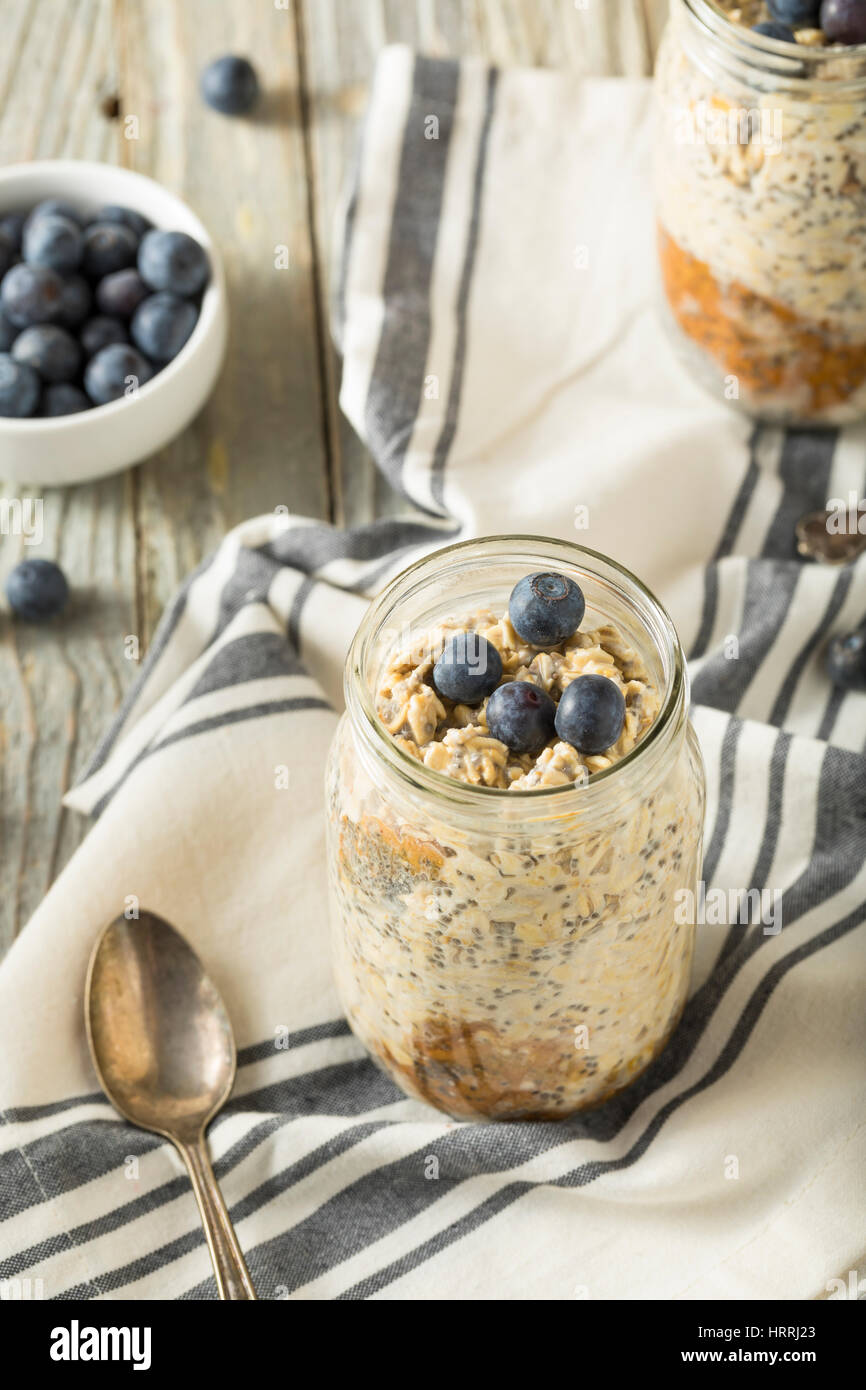 Healthy Homemade Overnight Oats Oatmeal with Chia and Peanut Butter Stock Photo