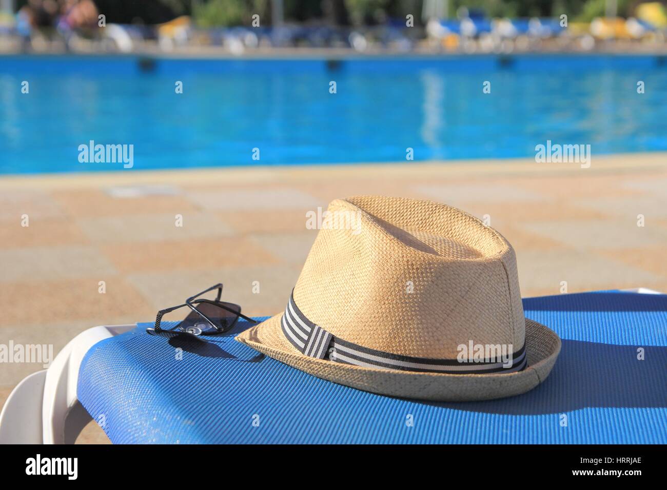 Straw hat floating in a pool hi-res stock photography and images - Alamy